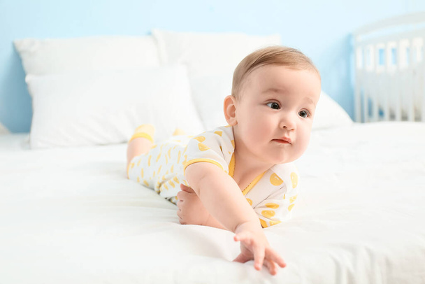 Cute little baby lying on bed, closeup - Photo, Image