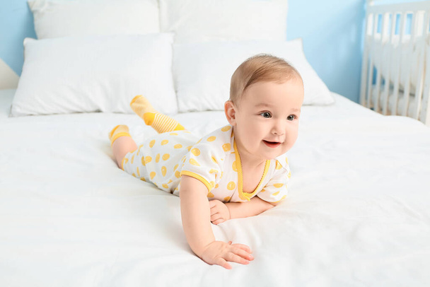 Cute little baby lying on bed - Photo, Image