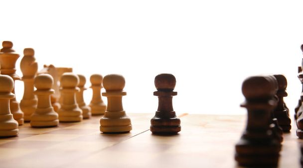 Chess pieces on game board, closeup - Фото, изображение