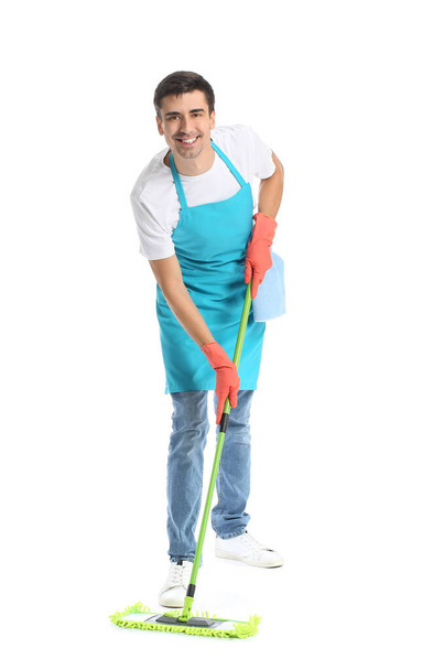Young man with floor mop on white background - Fotó, kép