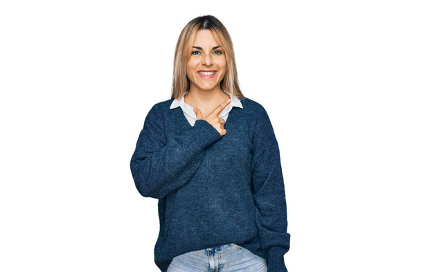 Young caucasian woman wearing casual clothes cheerful with a smile on face pointing with hand and finger up to the side with happy and natural expression  - Photo, Image