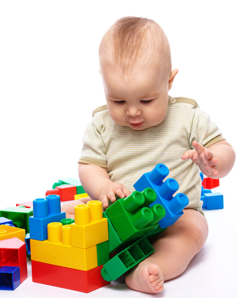 Little boy with building bricks - Photo, image