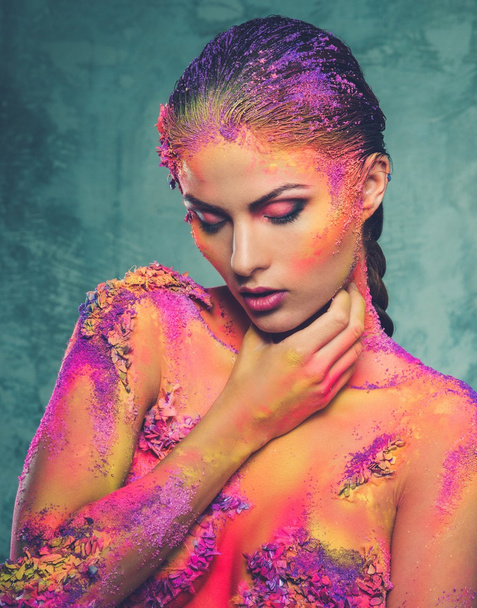 Beautiful young woman with conceptual colourful body art  - Foto, afbeelding