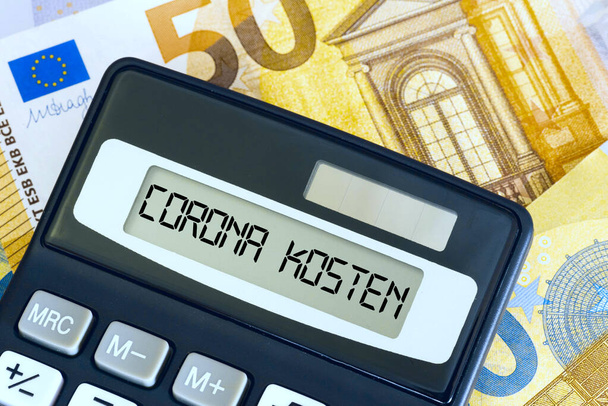 Euro banknotes, calculators and costs for the Corona crisis - Photo, Image