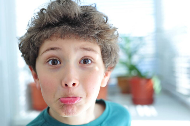 Cute little boy makes funny faces - Photo, Image