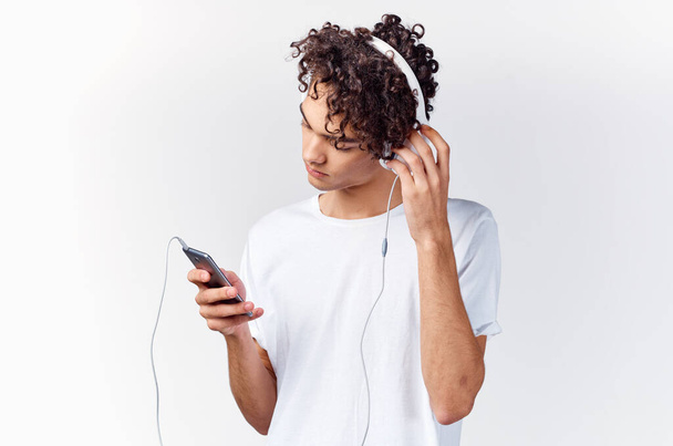 t-shirt with headphones listening to music lifestyle cropped view - Foto, Imagen