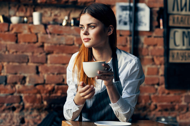 pretty woman waiter holding mug brick wall restaurant - Photo, Image