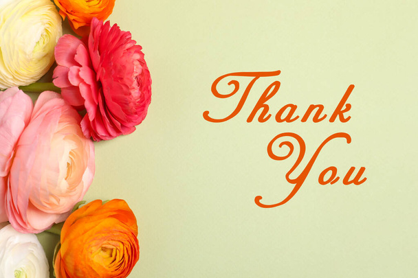 Beautiful ranunculus flowers and text Thank You on light background, flat lay. Greeting card design - Fotó, kép