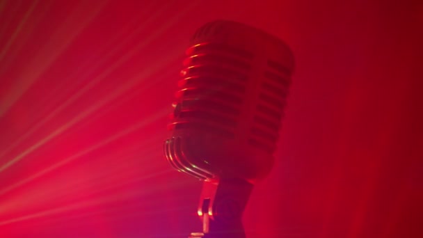 Vintage microphone with stage disco lights. Live performance or karaoke concept. - Footage, Video