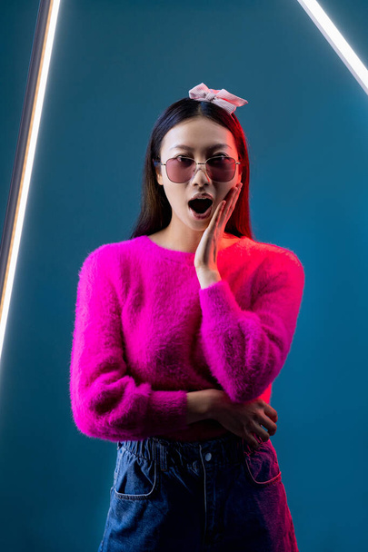 surprised girl neon light portrait asian woman wow - Foto, Bild