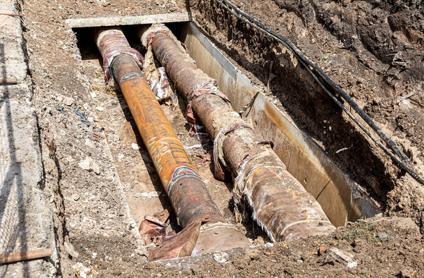 Repair and replacement of underground communications on the city street. Replacement pipes of the heating main in summertime - Photo, Image