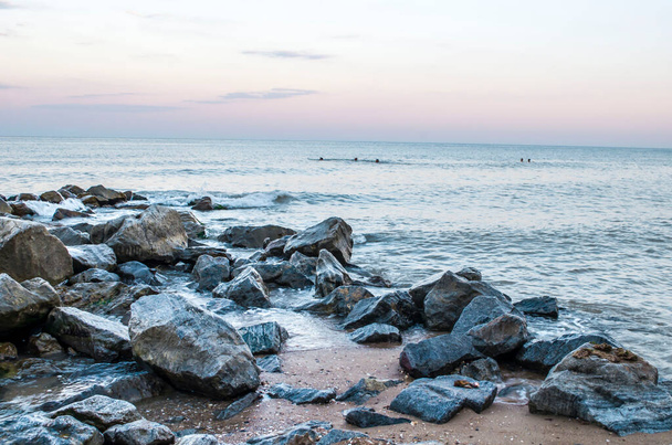 Sea stones boulders sandy shore. Natural landscape photo. - Foto, Imagem