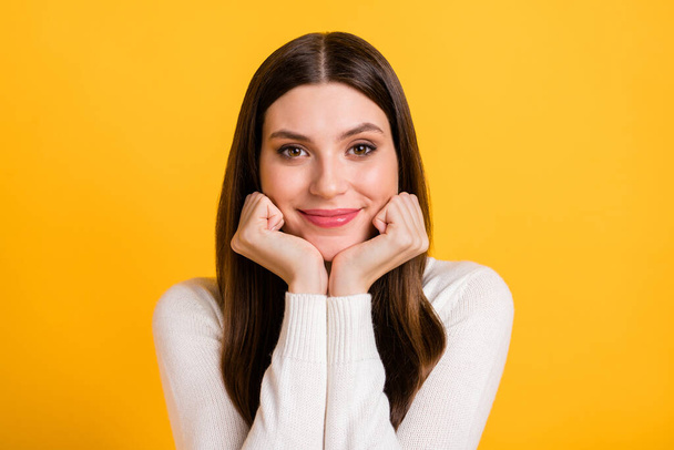 Portrait of satisfied young lady hands under chin look camera smile isolated on yellow color background - Fotografie, Obrázek