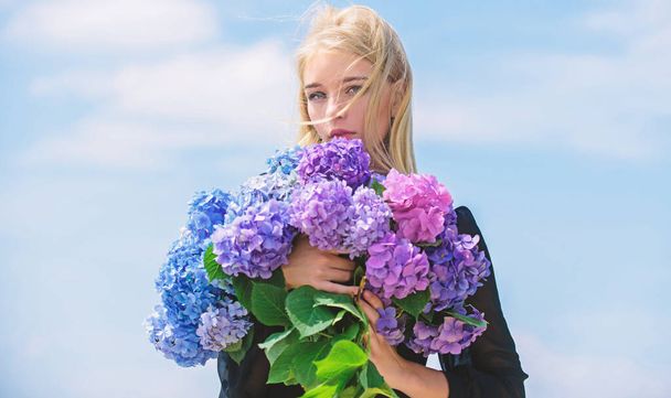 Girl tender blonde hold hydrangea bouquet. Allergy free life. Stop allergy blooming season. Springtime bloom. Pollen allergy. Female adore flowers. Spring attributes. Enjoy spring without allergy - Foto, immagini
