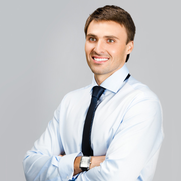 Portrait of business man, over gray background - Photo, Image