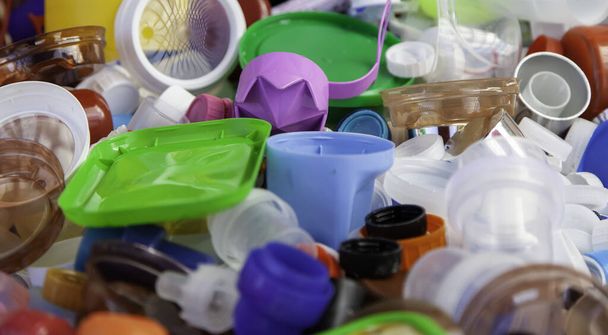 Plastic caps for recycling in containers, climate change and reuse - Φωτογραφία, εικόνα