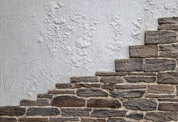 Mur avec briques et une partie de blanchisserie altérée. - Photo, image