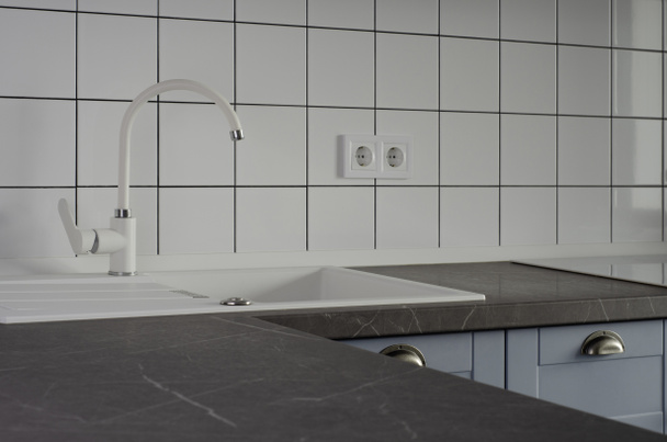 White sink on the background of a modern kitchen with white tiles. Clean background - Foto, immagini