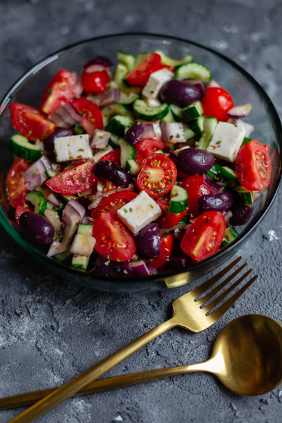 Greek salad on grey surface. - Photo, Image