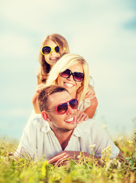 happy family with blue sky and green grass - 写真・画像