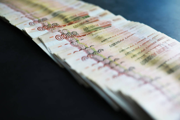 Banknotes with inscription "five thousand rubles". Russian money face value of five thousand rubles. Close-up of Russian rubles . The concept of Finance.Background and texture of money - Φωτογραφία, εικόνα