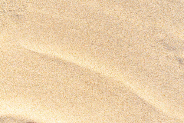 Homok minta textúra a háttérben. Barna sivatagi minta a trópusi tengerpartról. Közelkép. - Fotó, kép