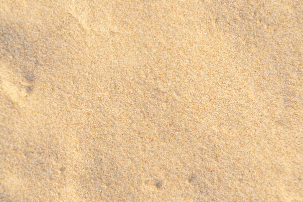 Sand texture background on the beach. Light beige sea sand texture pattern, sandy beach background. - Фото, зображення