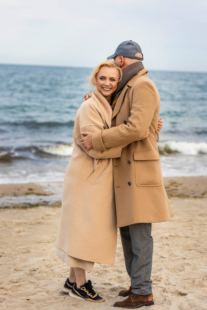aged couple walking by the sea - Φωτογραφία, εικόνα