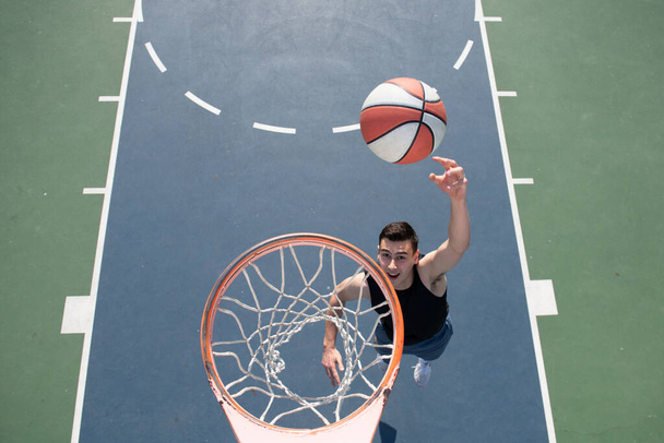 Basketball street player with basketball ball outdoor. - Fotografie, Obrázek