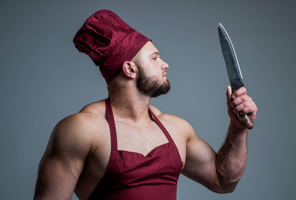I love my job. muscular man use barbecue knife utensils. guy eating healthy. food for athletes. sexy man with knife in cook apron. professional handsome chef cooking bbq. culinary and cuisine - Zdjęcie, obraz