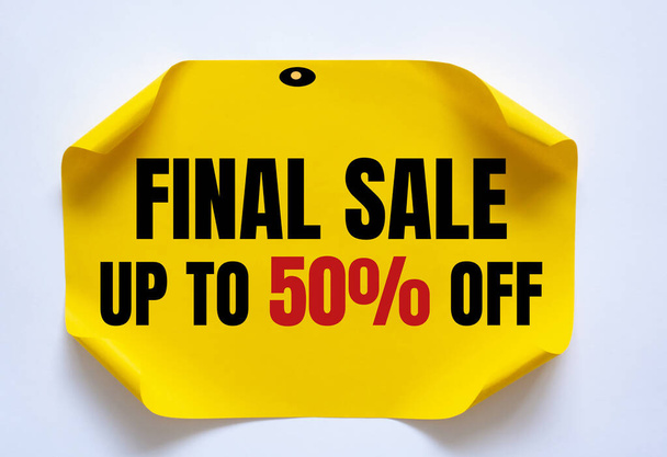 FINAL SALE UP TO 50 percent text on yellow tag on a white background - Photo, Image