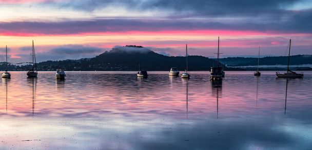 A soft pretty sunrise panorama with boats and fog at Koolewong Waterfront on the Central Coast, NSW, Australia. - Zdjęcie, obraz