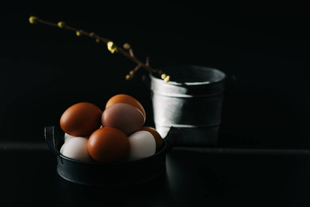 Chicken eggs in vintage tray on a black background. Organic, biological, bio products, bio ecology, healthy. - Foto, Bild