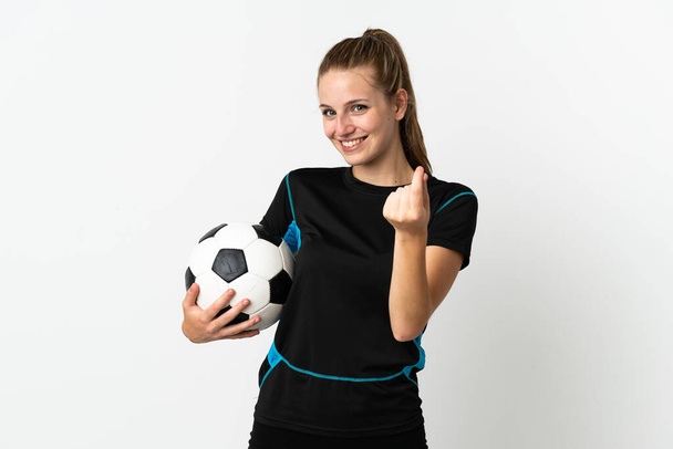 Jovem jogador de futebol mulher isolada no fundo branco fazendo gesto de dinheiro - Foto, Imagem