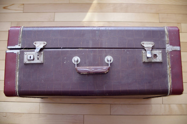 large vintage brown closed suitcase  - Фото, изображение