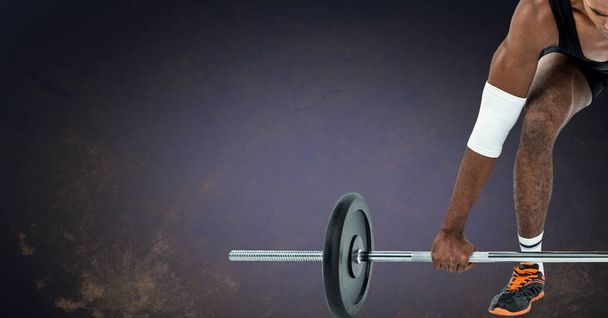 Composition of low section of strong african american man lifting barbell with copy space. sport, fitness and active lifestyle concept digitally generated image. - Φωτογραφία, εικόνα