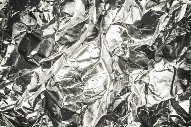 Crumpled aluminum foil texture background. - Photo, Image
