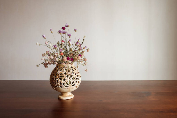 Still life with a bouquet of dried flowers in a ceramic pot - Photo, Image