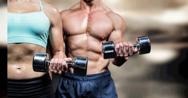 Composition of strong caucasian woman and man lifting dumbbells with copy space. sport, fitness and active lifestyle concept digitally generated image. - Foto, Bild