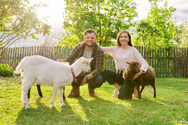 Small farm with ouessant sheep and goat, portrait of family couple of farm owners - Foto, Imagem