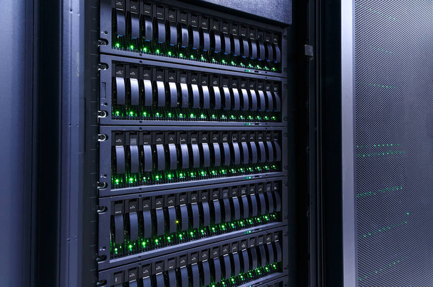 servers stack with hard drives in datacenter for backup and data storage - Photo, Image