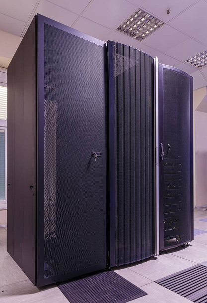 Black servers and hardwares in an internet data center - Photo, Image
