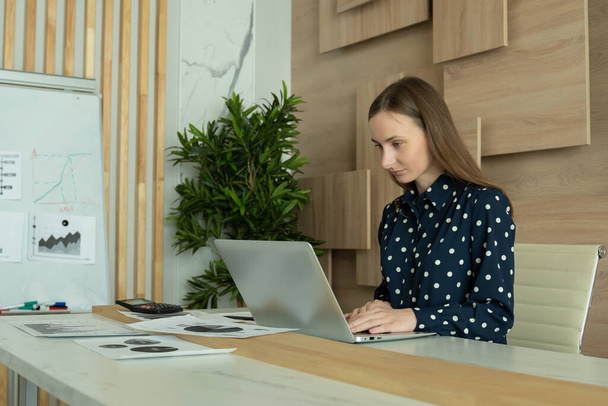 Business woman typing on laptop writing online working at office desk.  - Valokuva, kuva