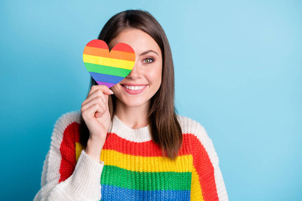 Photo of optimistic brunette lady show rainbow heart wear sweater isolated on blue color background - Foto, imagen