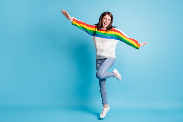Full length body size view of pretty carefree cheerful girl jumping dancing fooling having fun isolated over bright blue color background - Fotografie, Obrázek