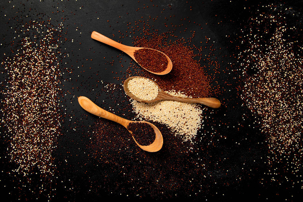 Set with different types of quinoa on dark background. Organic food concept. Top view - Photo, Image
