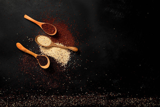 Set with different types of quinoa on dark background. Organic food concept. Top view, copy space - Photo, Image