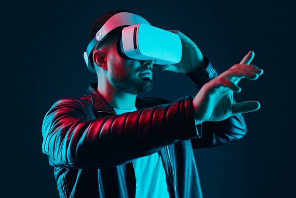 Man in VR headset touching air - Foto, Imagem