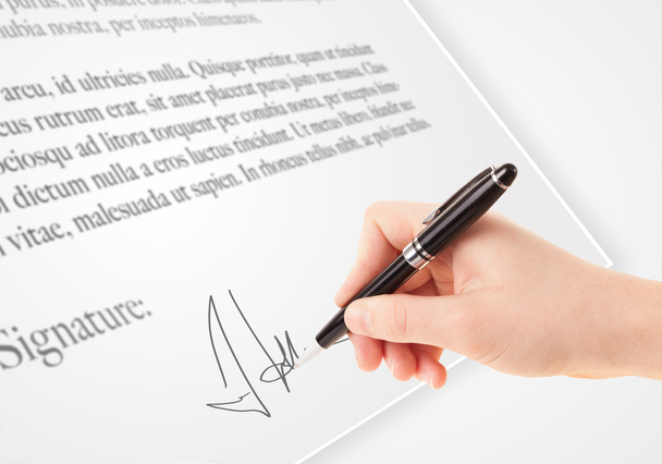 Hand writing personal signature on a paper form - Photo, Image