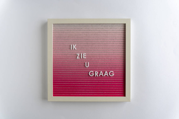 Pink Letterboard Words That Spell Ik Zie U Graag (transfeld: I love you), on the white background, hhhontal - Фото, изображение